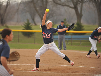 Photo of Erin Gaston pitching at a game on the KCC Softball Field