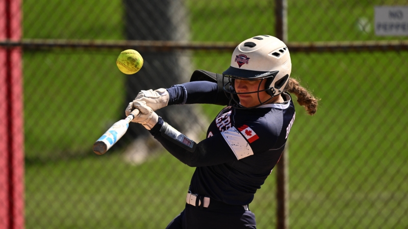 Softball player #3 Brittyn Bailey hitting the ball