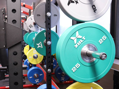 Weights on a rack in the KCC Athletics Weight Room